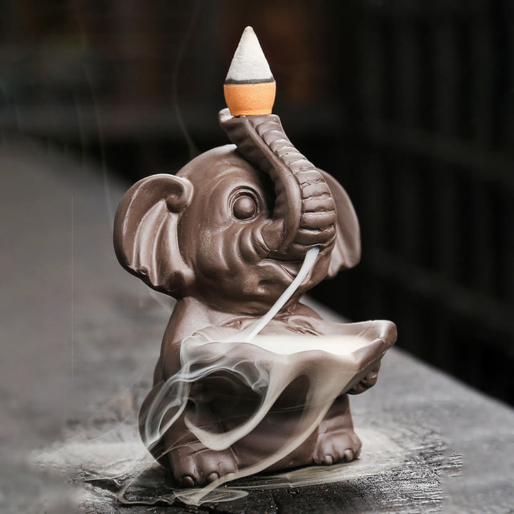 Buddha Stones, piccolo elefante che tiene una foglia, argilla viola, fontana di fumo a riflusso, bruciatore di incenso curativo, decorazione - image 1