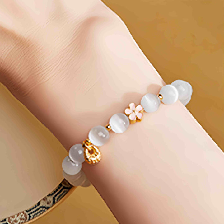 Buddha Stones Braccialetto portafortuna in argento sterling 925 con fiore di pesco e occhio di gatto bianco - image 9