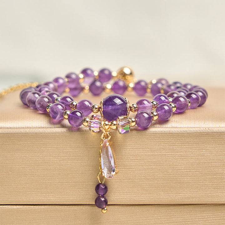 Bracciale multistrato in perle di ametista naturale Buddha Stones