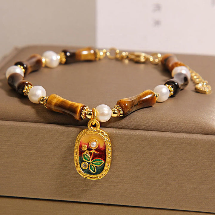 Bracciale Buddha Stones in bambù naturale con occhio di tigre e perle - image 2