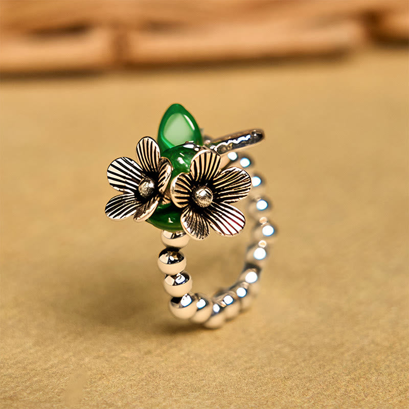 Anello elastico portafortuna in lega di rame con motivo floreale e Buddha Stones - 14-20 mm (corda elastica) - image 1