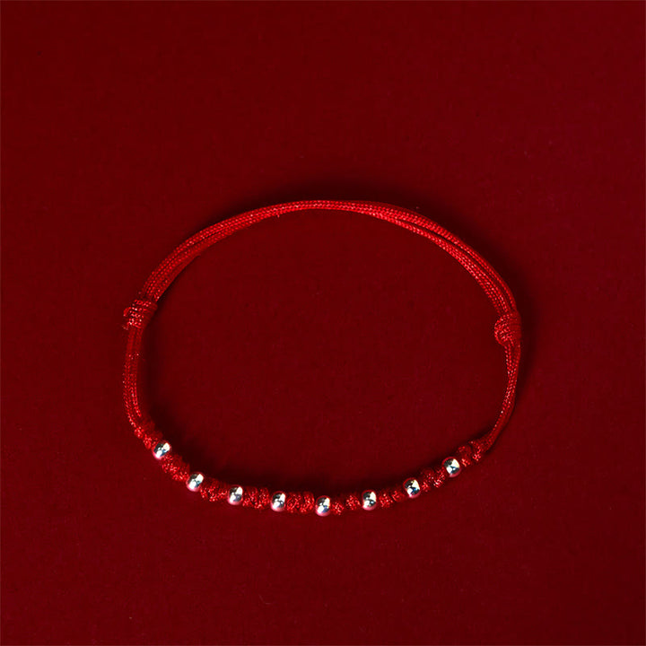 Braccialetto portafortuna regolabile con perline in argento sterling 925 e cordino rosso Buddha Stones - image 1