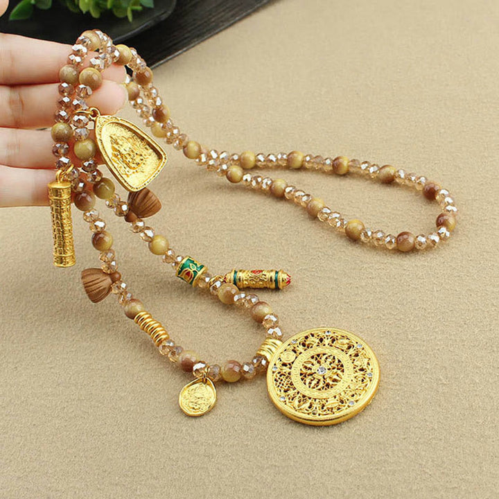 Collana con ciondolo in perle di occhio di tigre dorato, piastra rotonda tibetana con Buddha Stones e loto - image 5