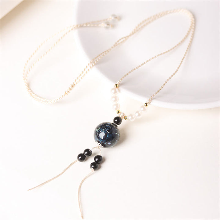Collana con Buddha Stones, ebano, lacca Aurora, perline artigianali, perle, equilibrio - Ciondolo blu scuro (blu casuale) - image 5
