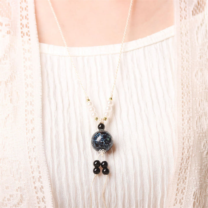 Collana con Buddha Stones, ebano, lacca Aurora, perline artigianali, perle, equilibrio - image 6