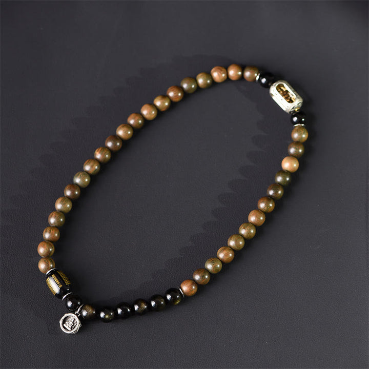 Bracciale a doppio giro in ossidiana, sandalo verde tibetano, lucentezza dorata e equilibrio della pace, Buddha Stones - image 2
