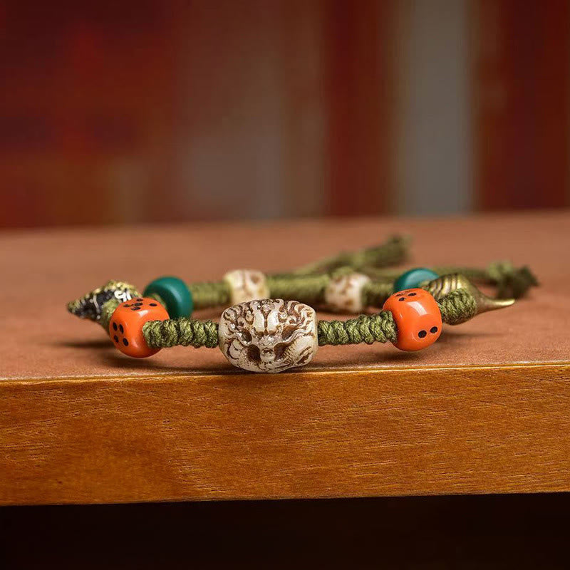 Braccialetto di corda fatto a mano con dadi e motivo drago tibetano di Buddha Stones - image 3