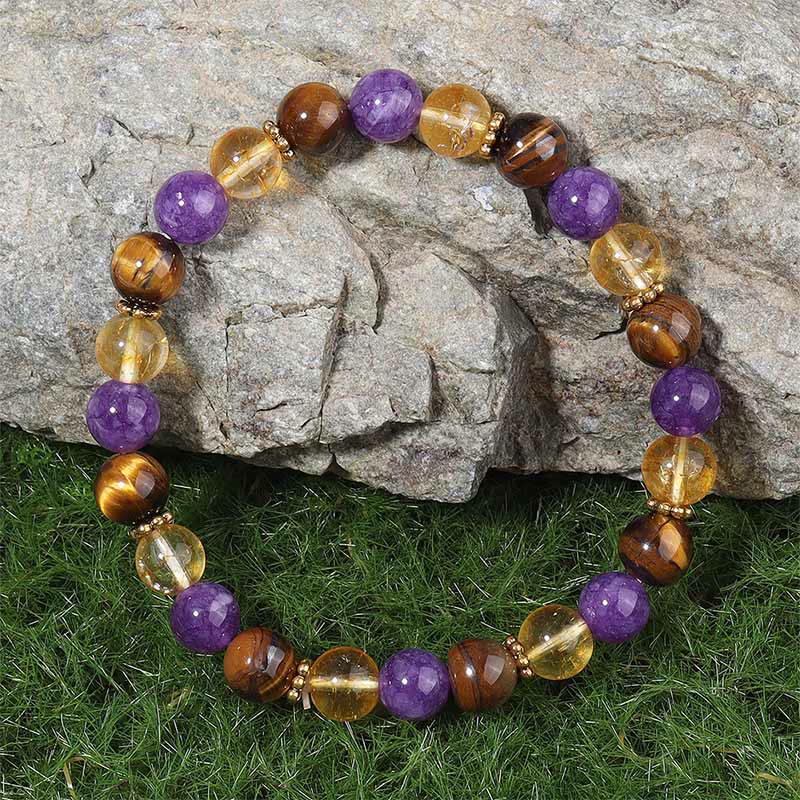 Braccialetto di guarigione con perline distanziatrici in Buddha Stones, ametista, occhio di tigre e citrino - image 1