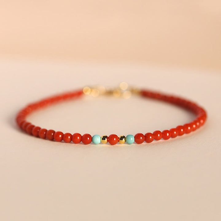Braccialetto positivo con perline ultrasottili in agata rossa naturale del sud da 3 mm Buddha Stones - Agata rossa del sud e turchese da 3 mm (circonferenza del polso: 14-17 cm) - image 0
