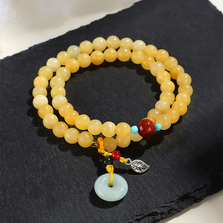 Bracciale della ricchezza con fibbia della pace a doppio giro in Buddha Stones e topazio - image 2
