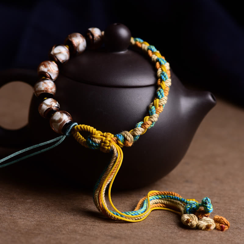 Braccialetto con cordino in vetro Liuli tibetano Buddha Stones simboli di salute e sicurezza - image 1