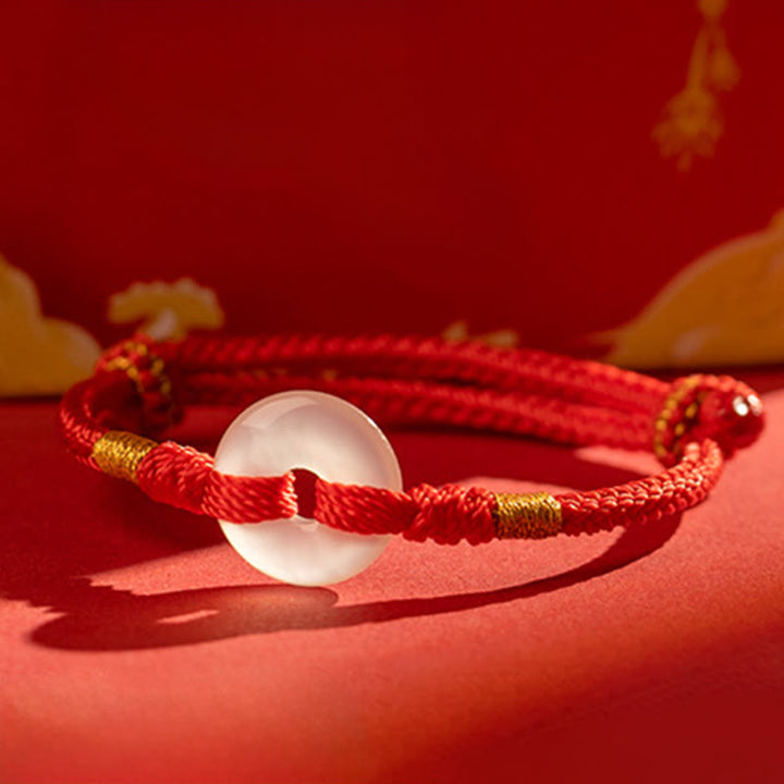 Bracciale intrecciato con fibbia della pace in calcedonio bianco Buddha Stones - image 1