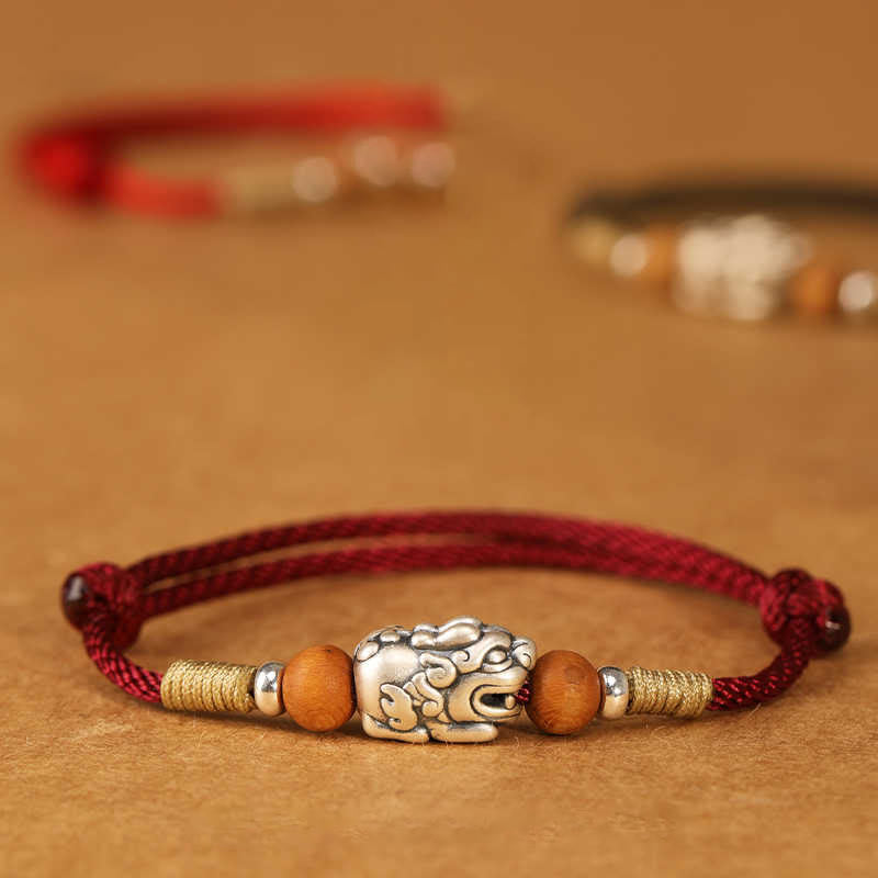 Braccialetto portafortuna intrecciato a mano con perline in legno di pesca, in argento sterling 999, con ciondolo Pixiu Buddha Stones - image 0