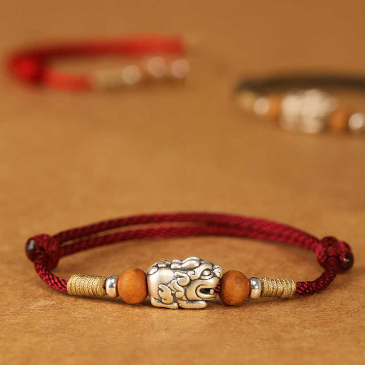 Braccialetto portafortuna intrecciato a mano con perline in legno di pesca, in argento sterling 999, con ciondolo Pixiu Buddha Stones - image 0