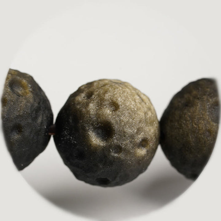 Braccialetto di protezione con perle rotonde in ossidiana dorata e argento naturale Buddha Stones - image 12