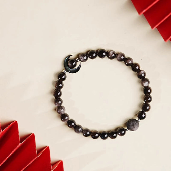 Braccialetto di perline di protezione in ossidiana lucida d'argento naturale con design a luna Buddha Stones - image 2