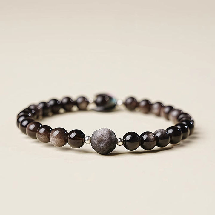 Braccialetto di perline di protezione in ossidiana lucida d'argento naturale con design a luna Buddha Stones - image 1