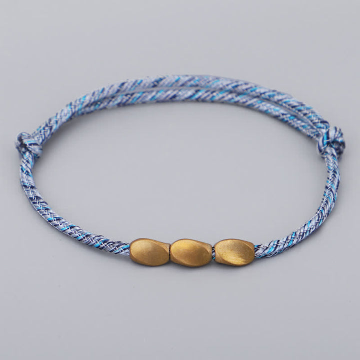 Buddha Stones Bracciale con perline di rame dorato e filo multicolore. - Blu celeste - image 7