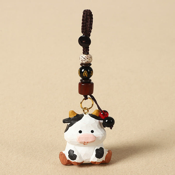 Buddha Stones Portachiavi in ​​legno di tiglio inciso con zodiaco cinese, fiore di pruno, pace e sicurezza, Om Mani Padme Hum, simbolo positivo. - Ox 4cm (Colore, forma e dimensioni possono variare) - Om Mani Padme Hum - image 13