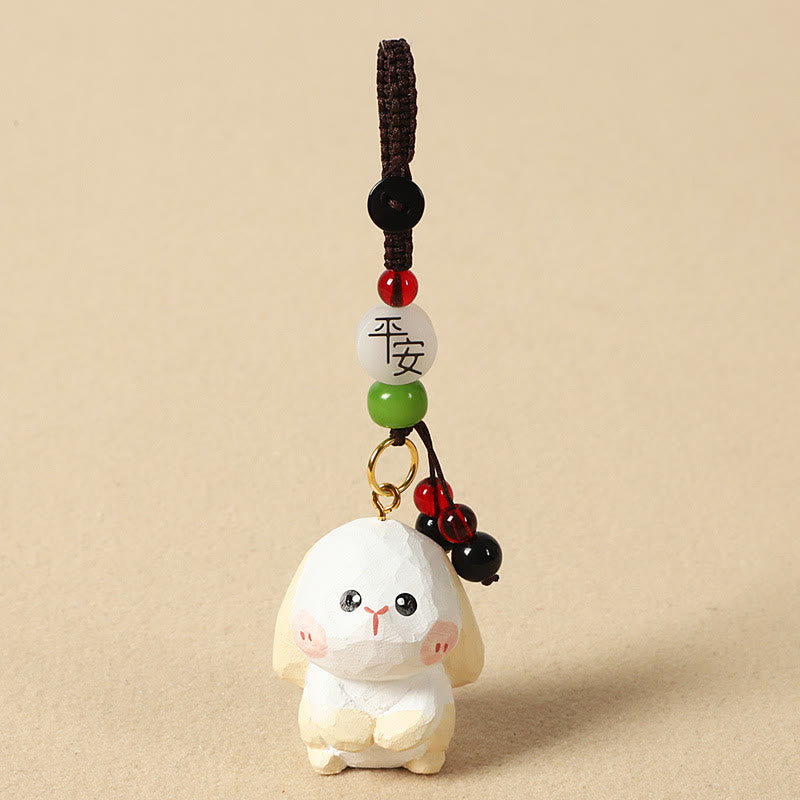Buddha Stones Portachiavi in ​​legno di tiglio inciso con zodiaco cinese, fiore di pruno, pace e sicurezza, Om Mani Padme Hum, simbolo positivo. - Coniglio di 4 cm (colore, forma e dimensioni possono variare) - Pace e sicurezza - image 21