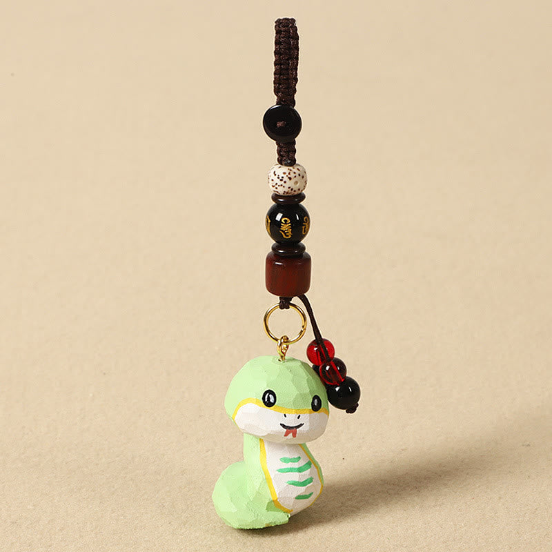 Buddha Stones Portachiavi in ​​legno di tiglio inciso con zodiaco cinese, fiore di pruno, pace e sicurezza, Om Mani Padme Hum, simbolo positivo. - Serpente di 4 cm (colore, forma e dimensioni possono variare) - Om Mani Padme Hum - image 25
