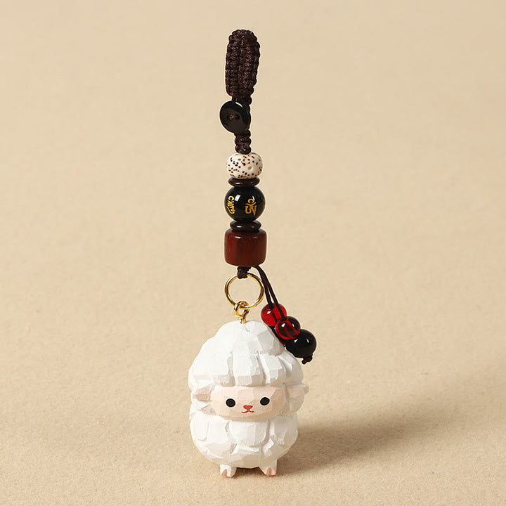 Buddha Stones Portachiavi in ​​legno di tiglio inciso con zodiaco cinese, fiore di pruno, pace e sicurezza, Om Mani Padme Hum, simbolo positivo. - Capra 4 cm (colore, forma e dimensioni possono variare) - Om Mani Padme Hum - image 0