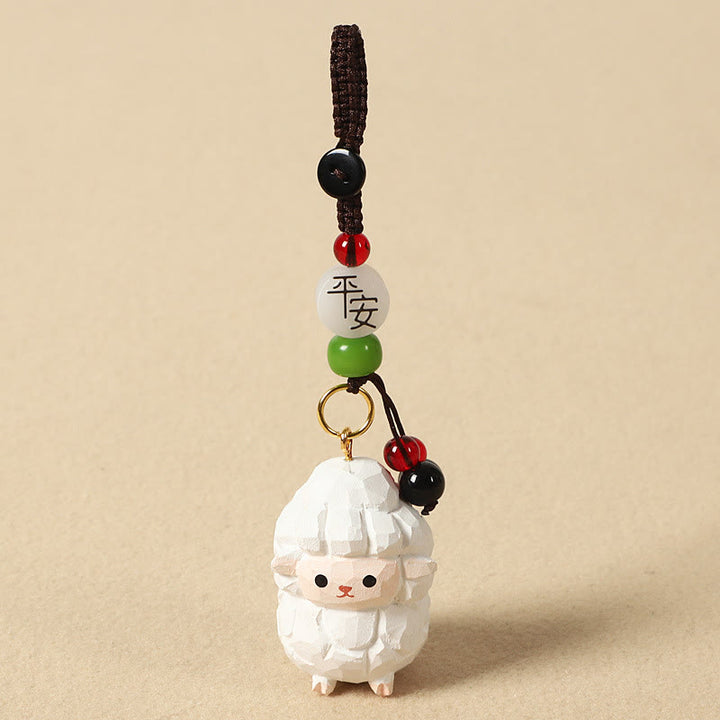 Buddha Stones Portachiavi in ​​legno di tiglio inciso con zodiaco cinese, fiore di pruno, pace e sicurezza, Om Mani Padme Hum, simbolo positivo. - Capra 4 cm (colore, forma e dimensioni possono variare) - Pace e sicurezza - image 2