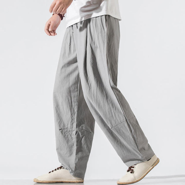 Buddha Stones Pantaloni lunghi estivi casual minimalisti da uomo con coulisse e elastico in vita, tinta unita, modello harem con tasche. - image 1
