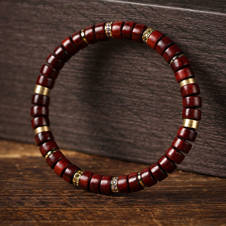 Buddha Stones Bracciale minimalista con perline a barilotto in legno di palissandro rosso e ebano. - image 0