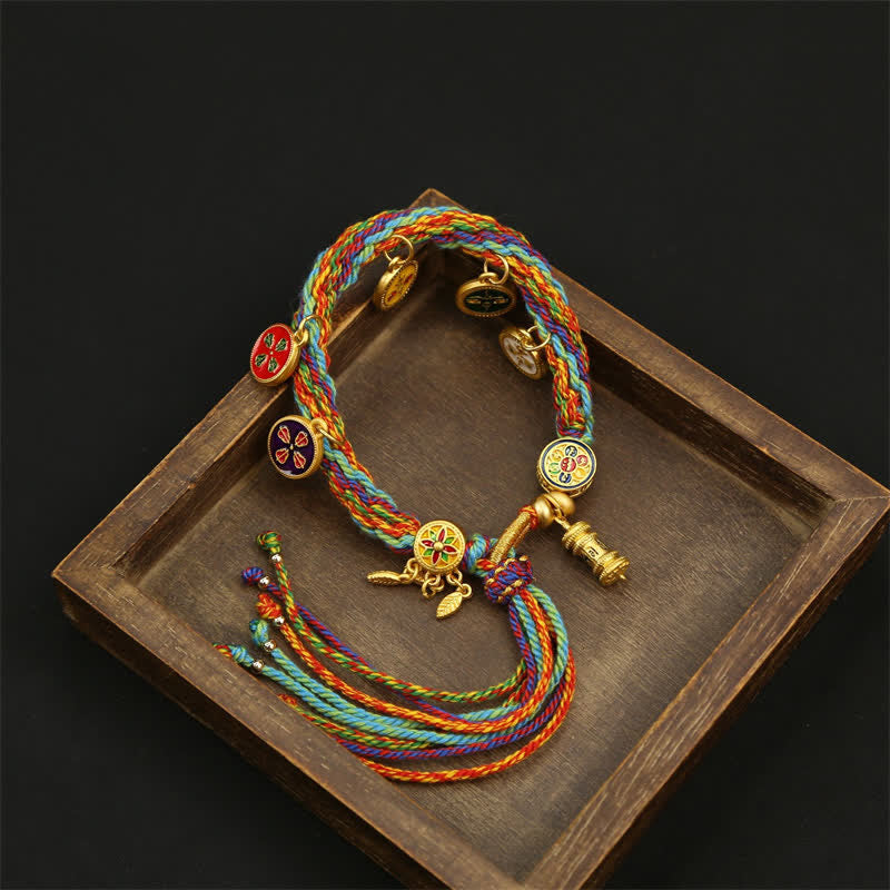 Buddha Stones Braccialetto con nappe e cordino intrecciato arcobaleno Om Mani Padme Hum Wisdom - image 1