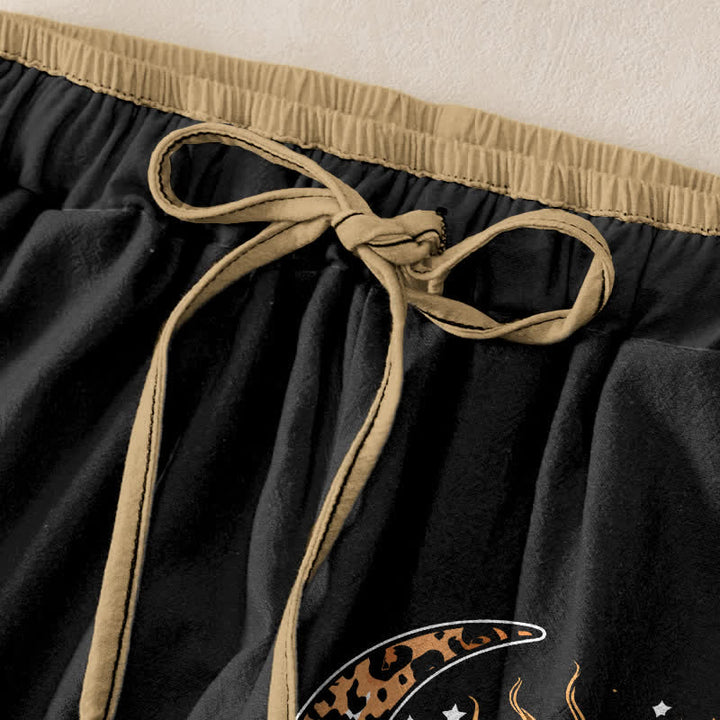 Buddha Stones Pantaloni da donna in puro cotone con elastico in vita e tasche, fantasia celeste sole e luna. - image 1