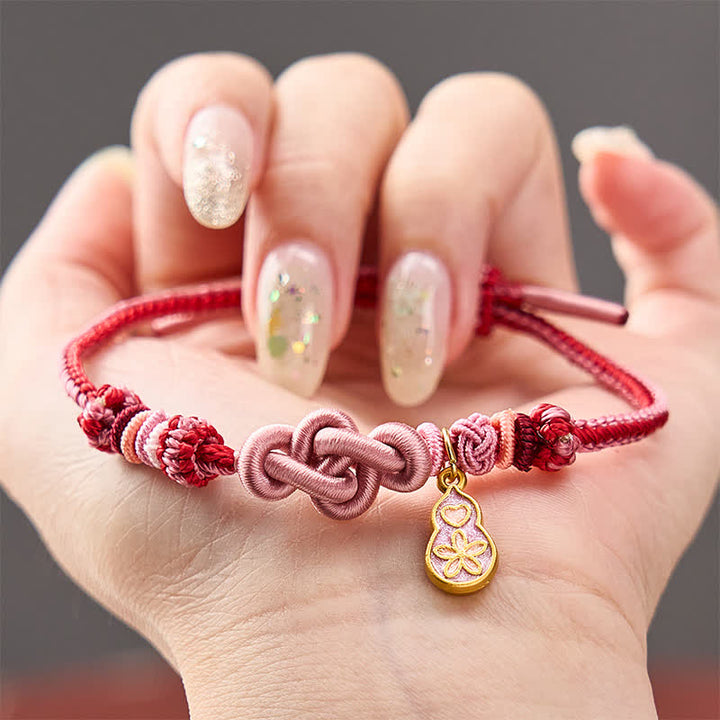 Buddha Stones Braccialetto intrecciato a mano con cordino rosa resistente a forma di zucca, con la scritta "Arricchisciti velocemente". - Rosa con accessorio a forma di zucca - image 0