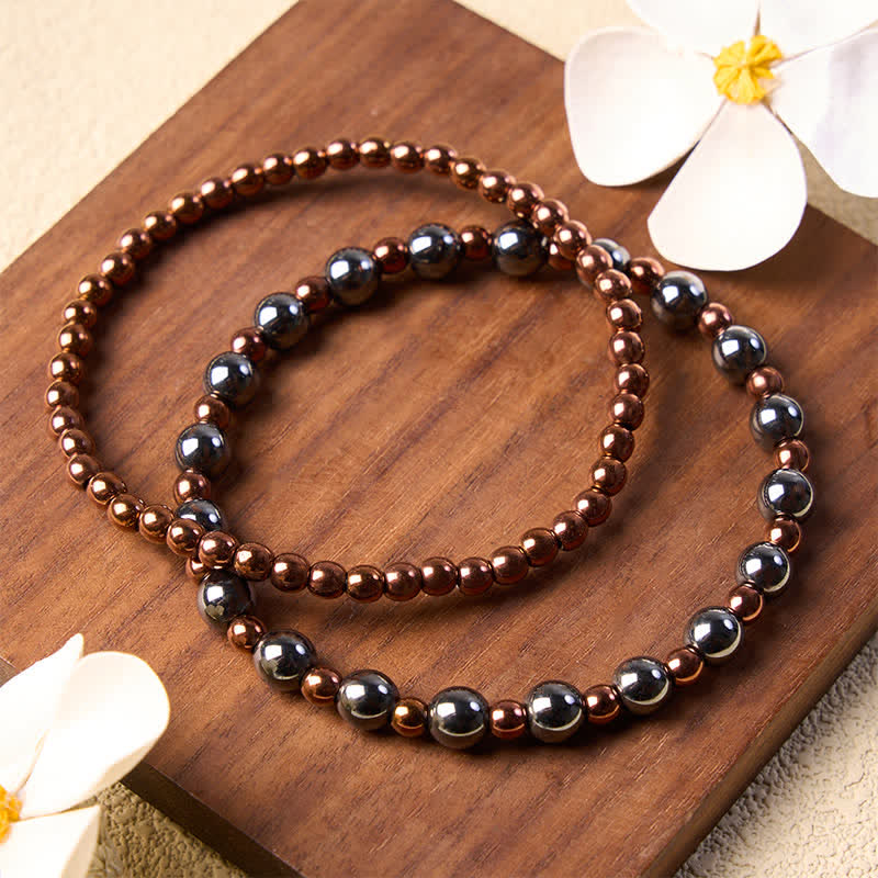 Buddha Stones Set di 2 braccialetti minimalisti rotondi in ematite per la messa a terra. - image 1