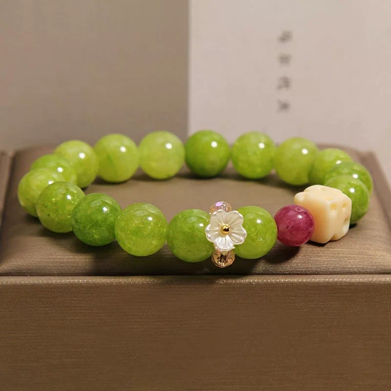 Buddha Stones Braccialetto curativo con ciondolo a forma di fiore di peridoto e perline - image 7