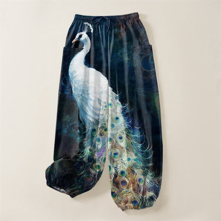 Buddha Stones Pantaloni harem da donna in cotone bianco con motivo a piume di pavone e vita elasticizzata, con tasche laterali. - image 3