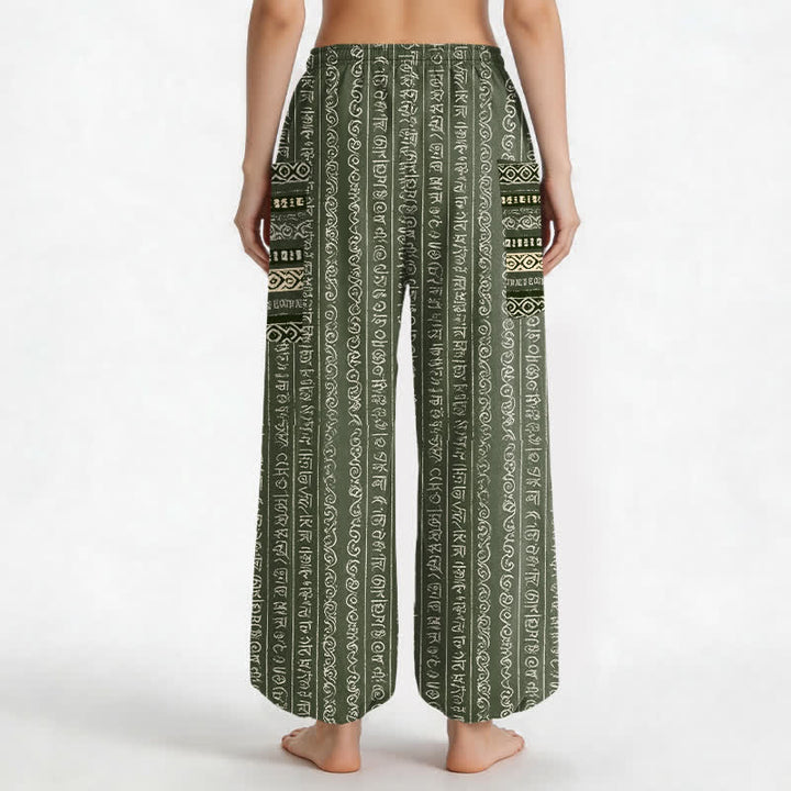 Buddha Stones Pantaloni harem da donna in cotone con elastico in vita e tasche laterali, fantasia a righe geometriche etniche. - image 9