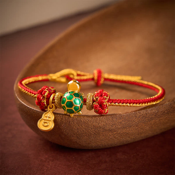 Buddha Stones Braccialetto portafortuna con tartaruga verde, zucca di rame e cordino rosso - image 1