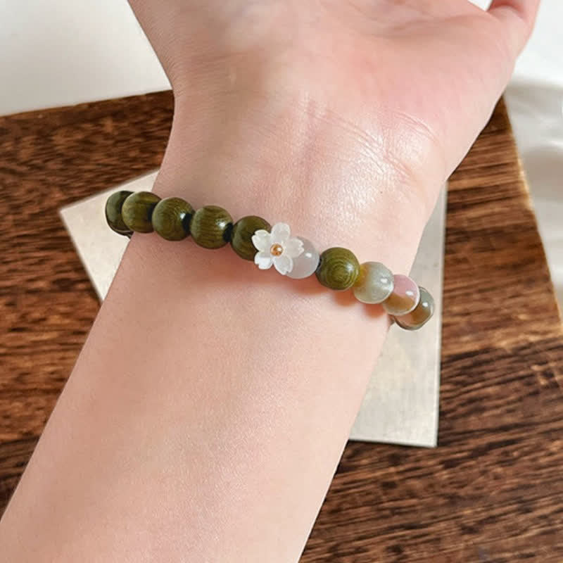 Buddha Stones Bracciale Serenity con ciondolo a forma di fiore occhio di gatto in legno di sandalo verde. - image 4