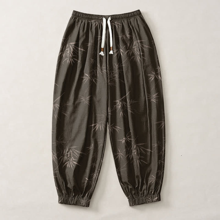 Buddha Stones Pantaloni harem da uomo in puro cotone con coulisse e tasche, fantasia a foglie di bambù. - image 1