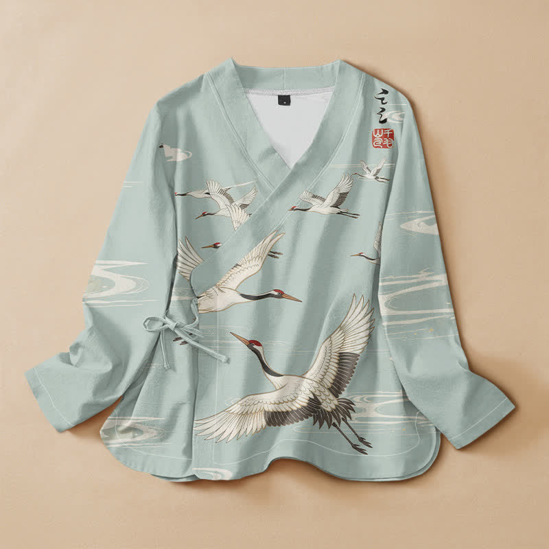 Kimono da donna a maniche lunghe con scollo a V e allacciatura, in cotone con stampa di gru volanti Buddha Stones. - Turchese pallido - US16, UK/AU20, EU48 (3XL) - image 0