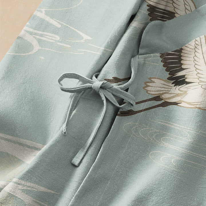 Kimono da donna a maniche lunghe con scollo a V e allacciatura, in cotone con stampa di gru volanti Buddha Stones. - image 3