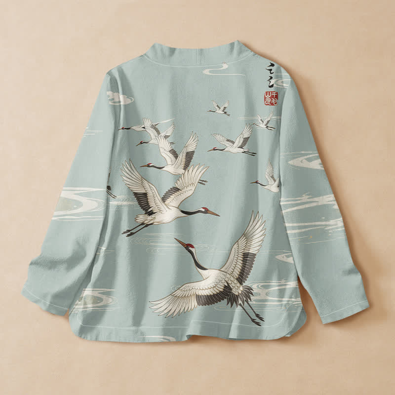Kimono da donna a maniche lunghe con scollo a V e allacciatura, in cotone con stampa di gru volanti Buddha Stones. - image 1
