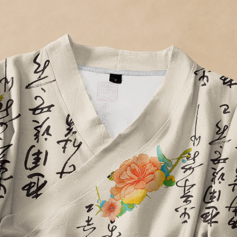 Kimono da donna a maniche lunghe con scollo a V e allacciatura, in cotone con stampa floreale e calligrafia ispirata Buddha Stones. - image 2