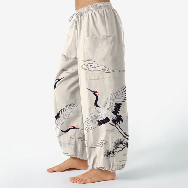 Buddha Stones Pantaloni harem da donna in cotone bianco con motivo gru Zen e vita elasticizzata, con tasche laterali. - image 1