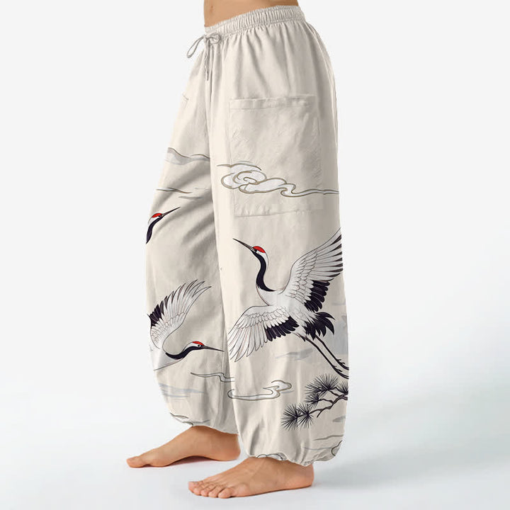Buddha Stones Pantaloni harem da donna in cotone bianco con motivo gru Zen e vita elasticizzata, con tasche laterali. - image 1
