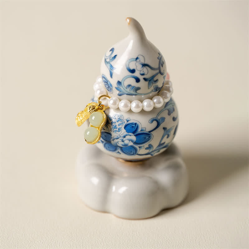Buddha Stones Zucca girevole in ceramica blu e bianca a forma di loto, decorazione per uno stile di vita consapevole. - Base bianca, circa 4,8 cm × 4,8 cm × 8,5 cm - image 0
