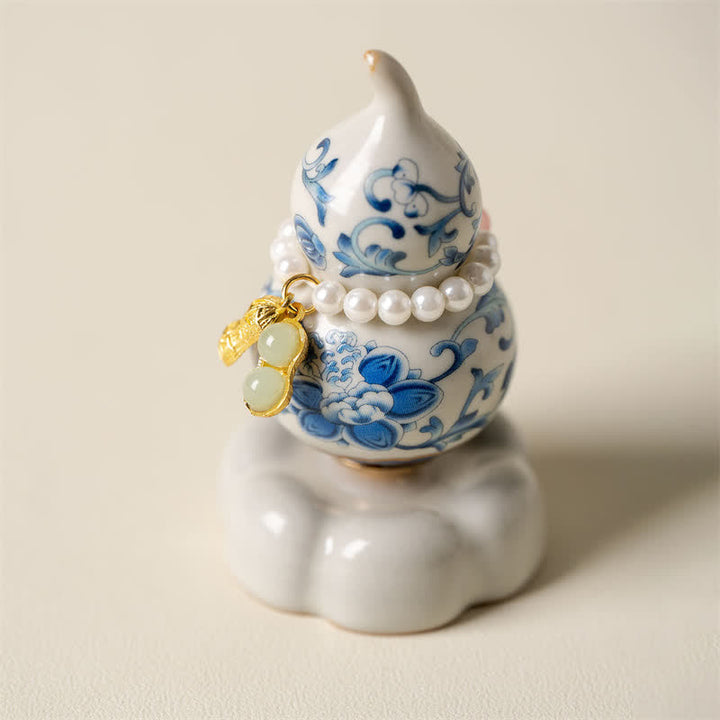 Buddha Stones Zucca girevole in ceramica blu e bianca a forma di loto, decorazione per uno stile di vita consapevole. - Base bianca, circa 4,8 cm × 4,8 cm × 8,5 cm - image 0