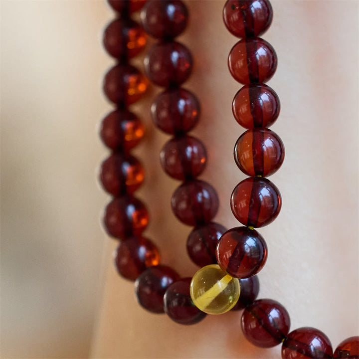 Braccialetto anti-ansia in ambra trasparente con 108 perle di Mala naturali Buddha Stones