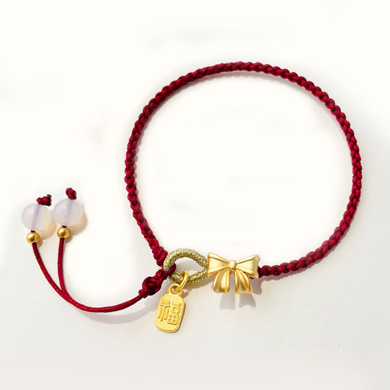 Braccialetto con corda rossa con ciondolo a forma di fiocco con rosetta in fiore di pesco fatto a mano con carattere Fu e nodo Buddha Stones