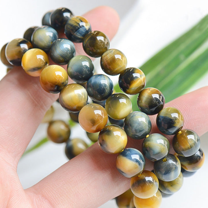 Braccialetto di protezione e forza con occhio di tigre Buddha Stones